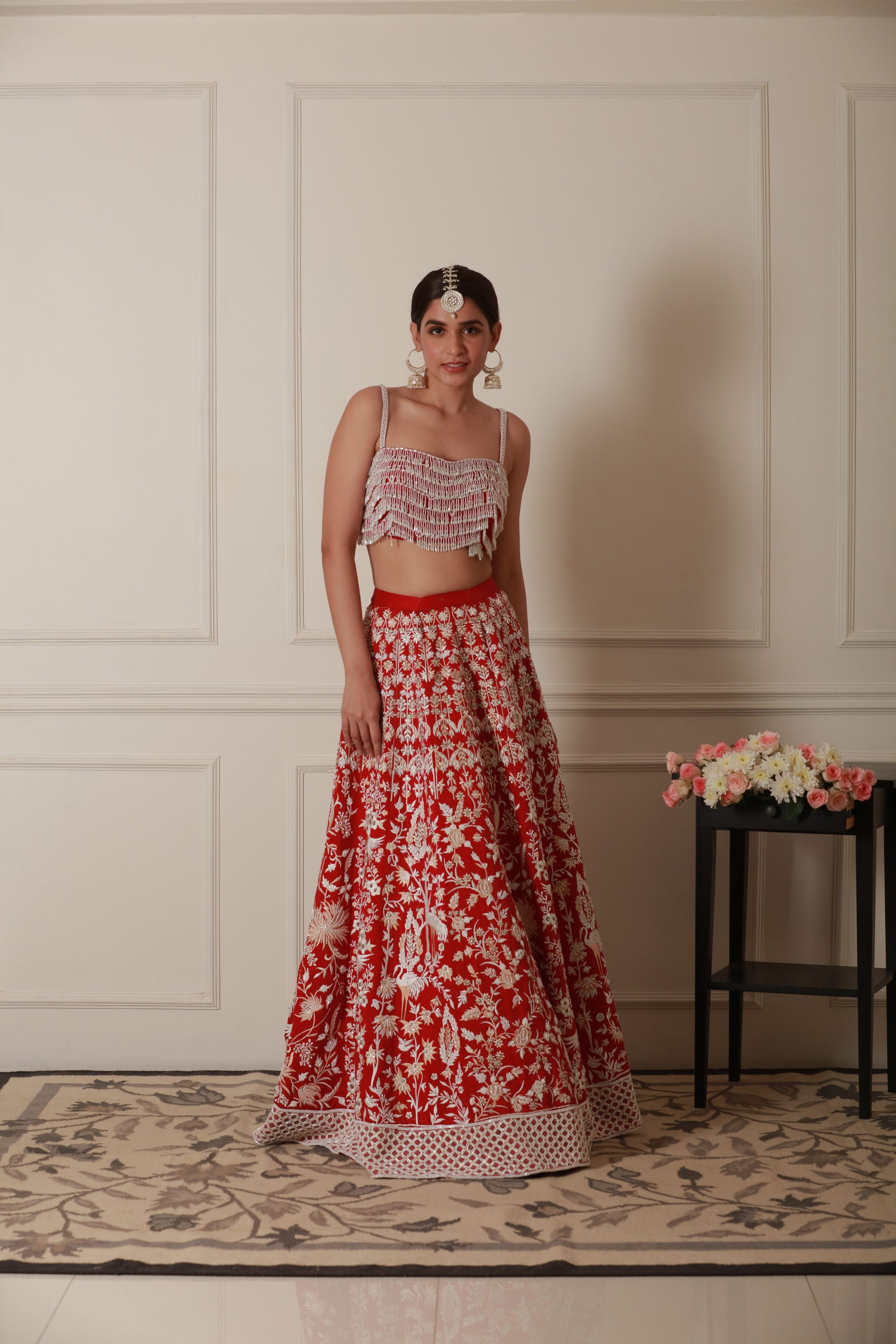 red lehenga with embroidery